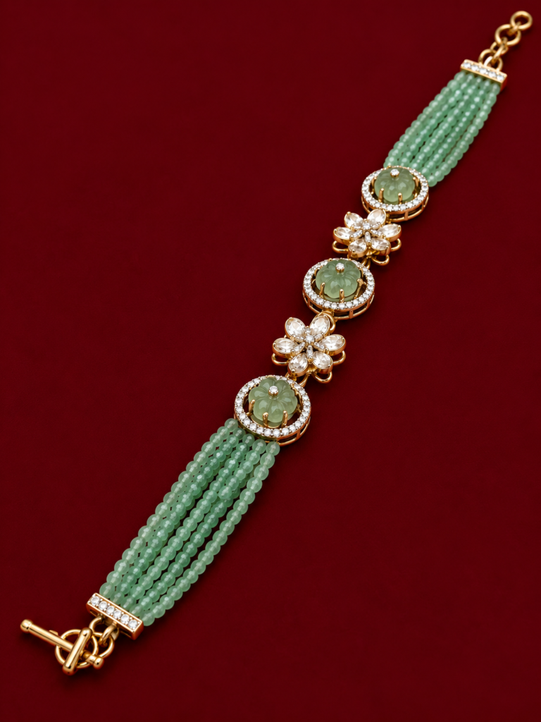elegant green gemstone bracelet on burgundy