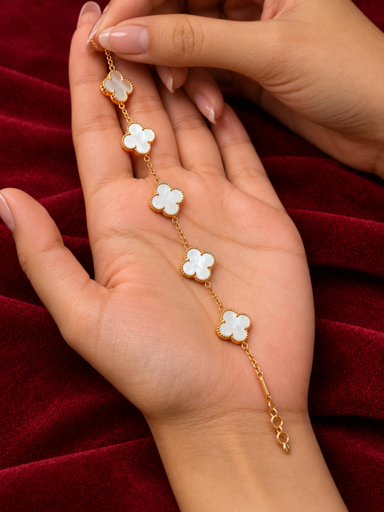 gold clover chain on a velvet palm (1)