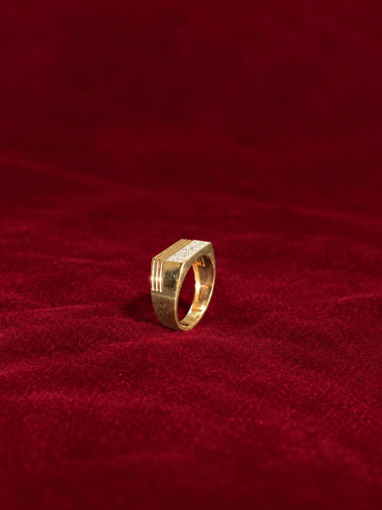 gold geometric ring on burgundy velvet