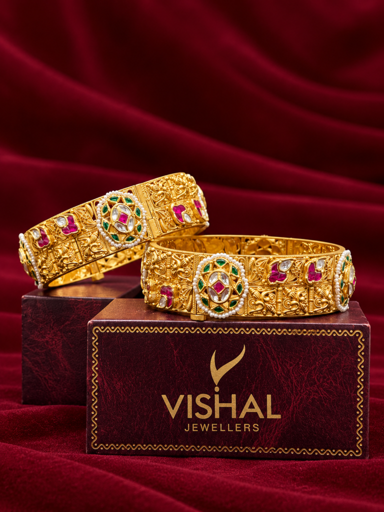 ornate gold bangles on velvet box