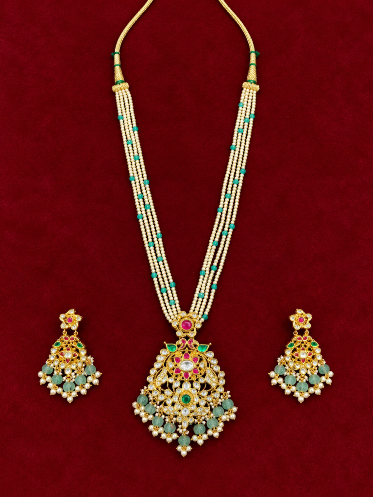 ornate gold pearl and emerald jewellery set