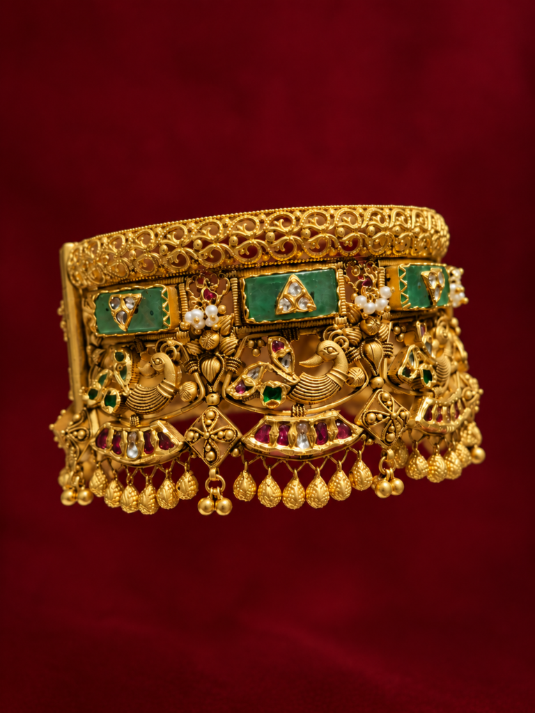 ornate gold temple bangle on burgundy
