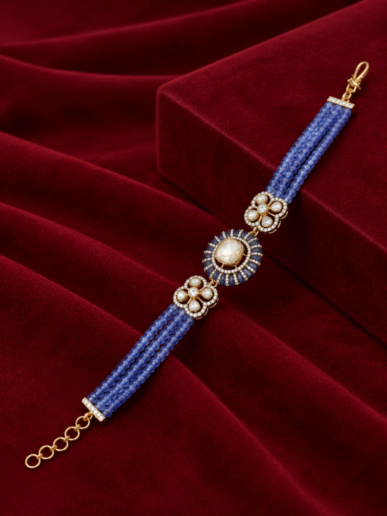 ornate tanzanite bracelet on burgundy velvet