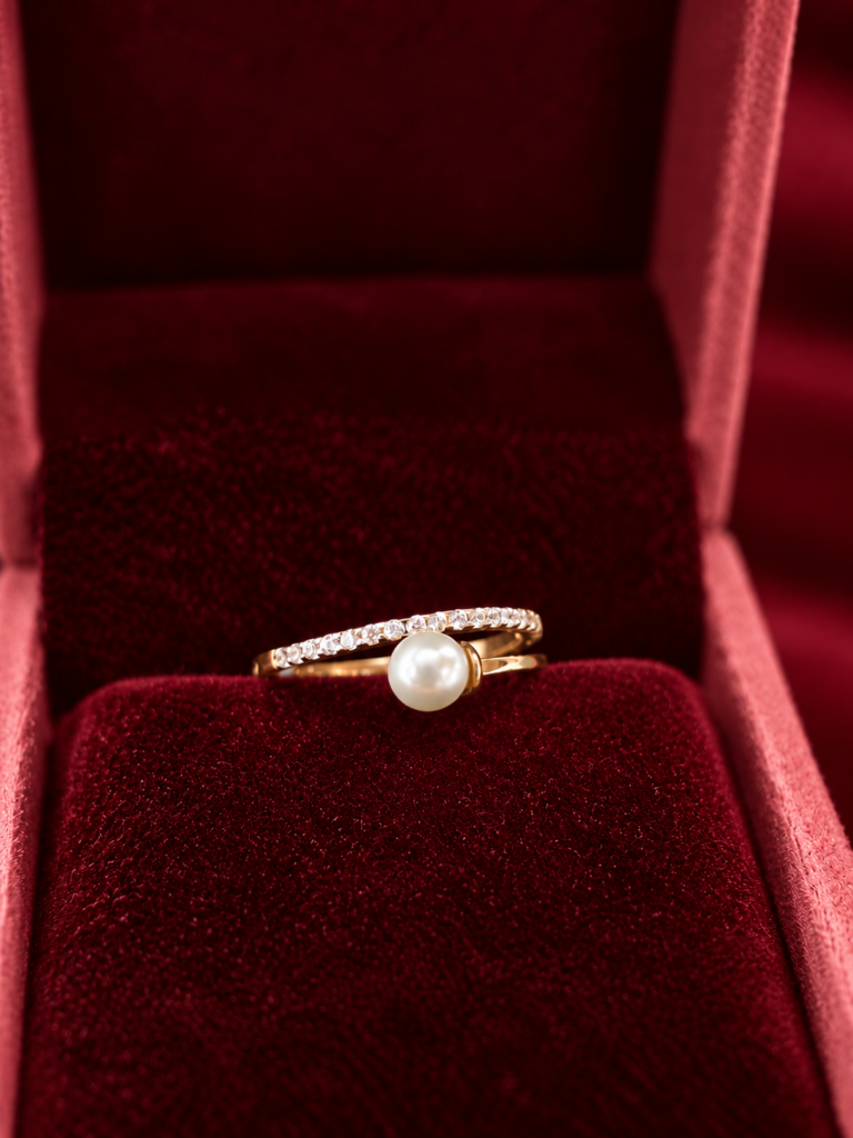 pearl and diamond ring in burgundy velvet